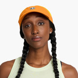 Gorra de running Ciele FSTCap SC Comp, color Sunset – en uso
